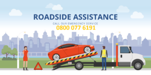 Tow truck loading a red car with roadside assistance team helping a driver in Red Lodge Suffolk IP28.